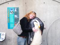 Tess with a giant emperor penguin