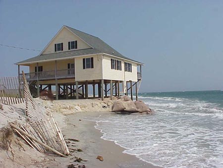 home falling into ocean