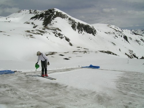 Scientists like Chris Landry, pictured, simulated dust effects on snowmelt in experiments.